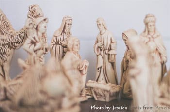 Here's an alt tag for the image: Cream-colored nativity scene figurines.