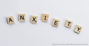 Here's an alt tag for the image: `Scrabble tiles spelling "anxiety"`