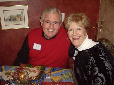 Smiling couple at a holiday dinner.