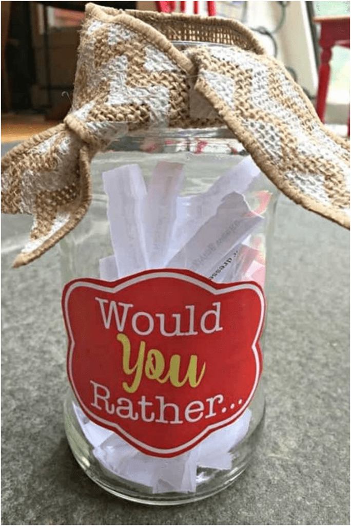 A jar with paper strips in it.