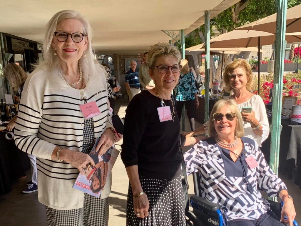 A group of women standing next to each other.