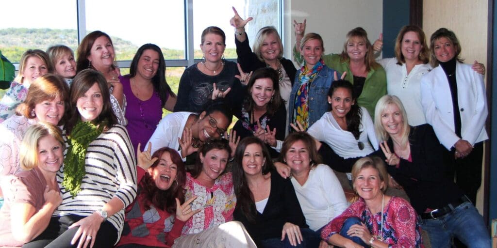 Group of women smiling for a photo.