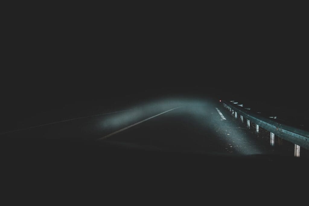 Night road, headlights, foggy.