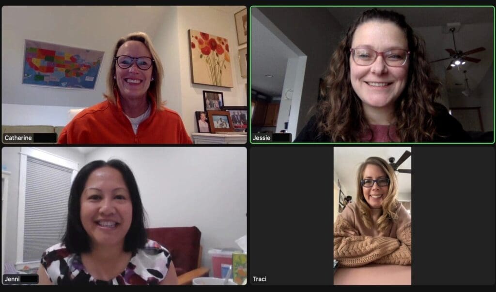 Four women in a virtual meeting.