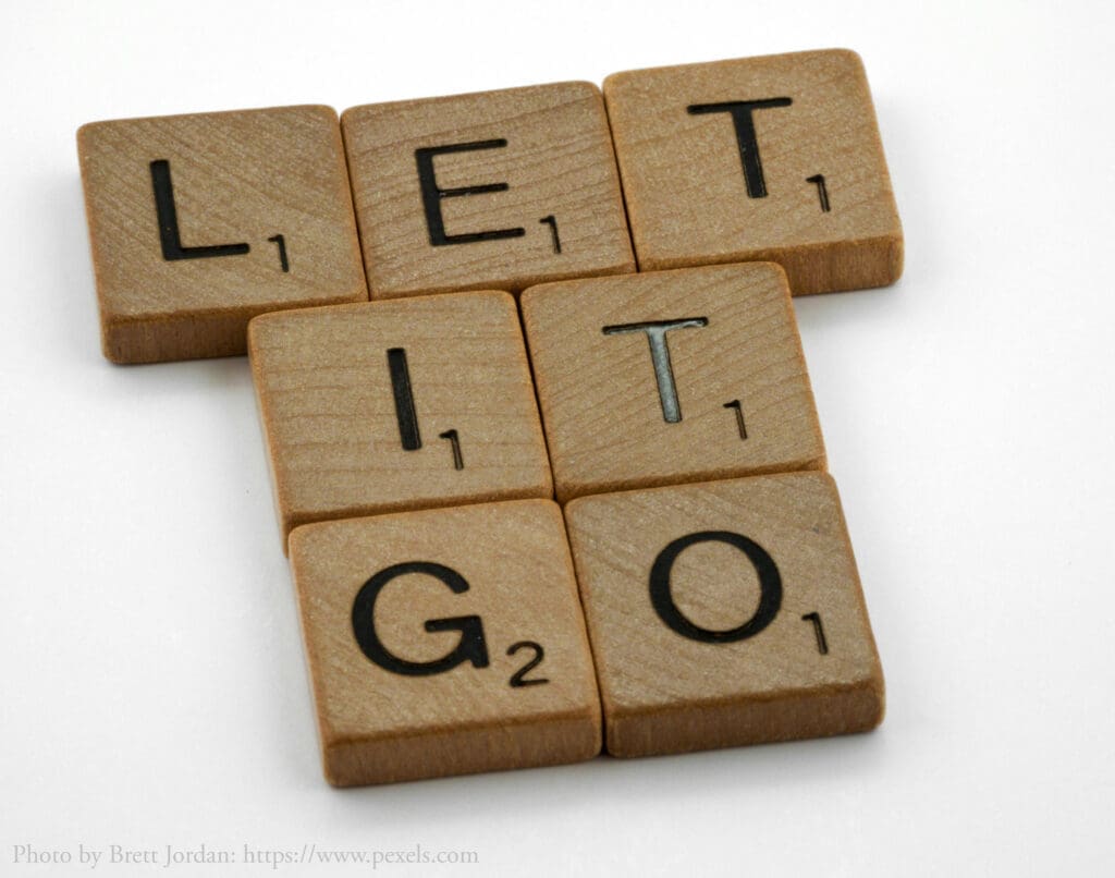 Scrabble tiles spell "Let it go".