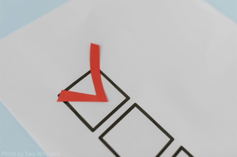 Paper with red checkmark and boxes.