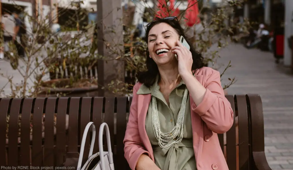 A man laughing with Talking on the mobile
